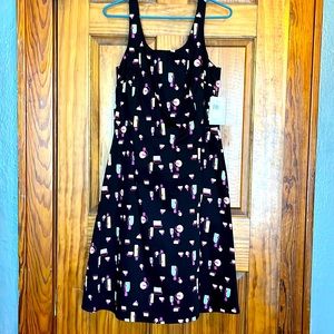 Sleeveless MIDI- dress by “Lily”. Black with colorful perfume bottle details.